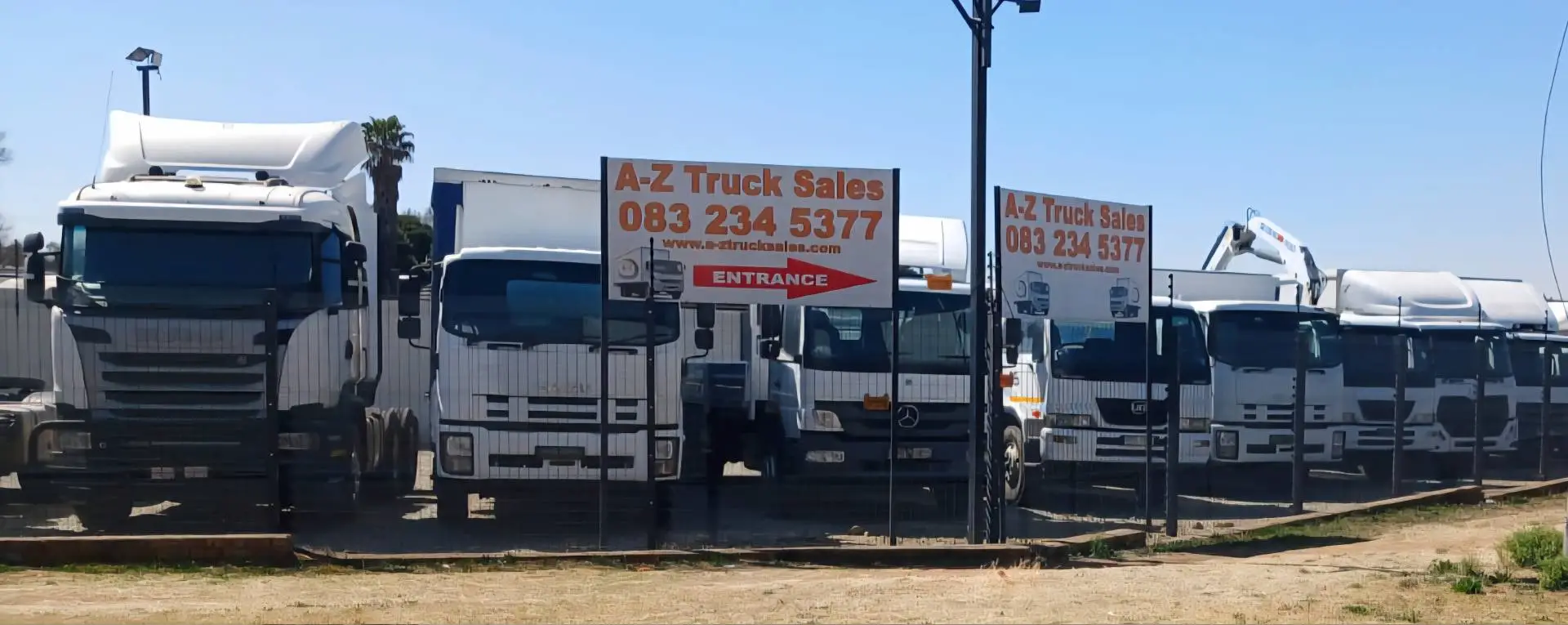 Used trucks parked at A-Z Truck Sales dealership in Gauteng